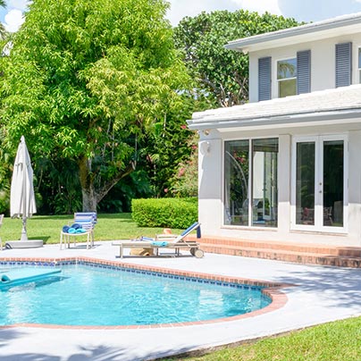 House backyard showing a pool and deck